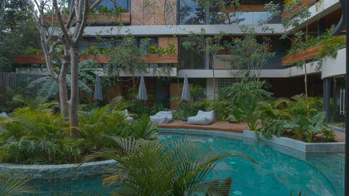 Image of Swimming Pool at Miraluna, featuring Swimming Pool, Lush Garden.