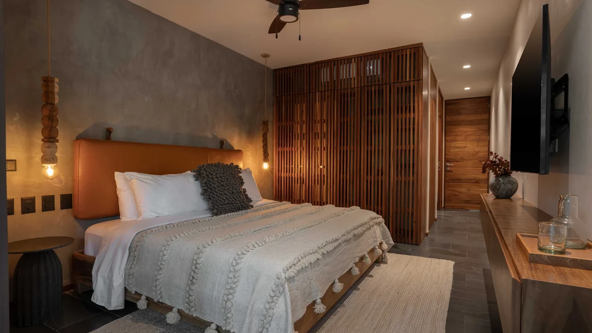 View of Luxury Bedroom at Miraluna, showcasing Modern Design, Wood Accents.