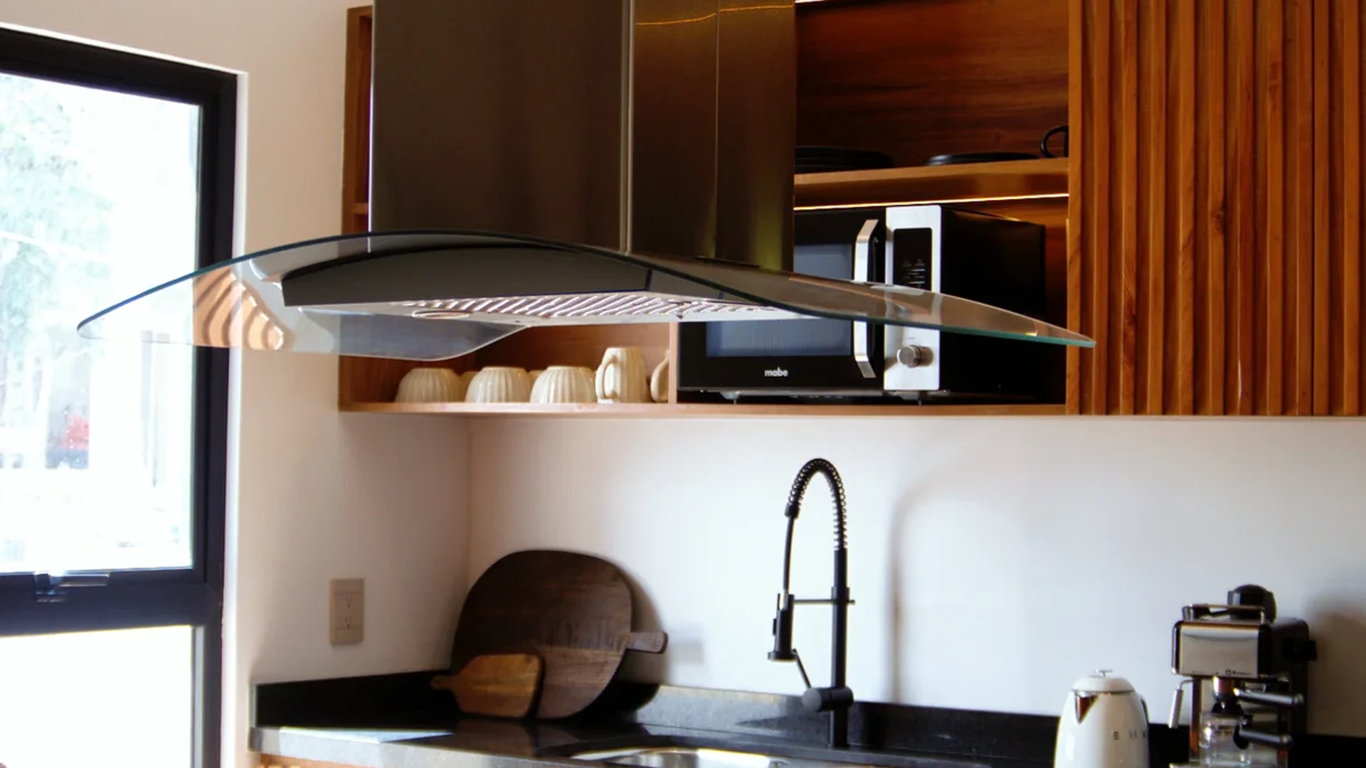 View of Modern Kitchen at Baikal, showcasing Kitchen Island, Stainless Steel Appliances.