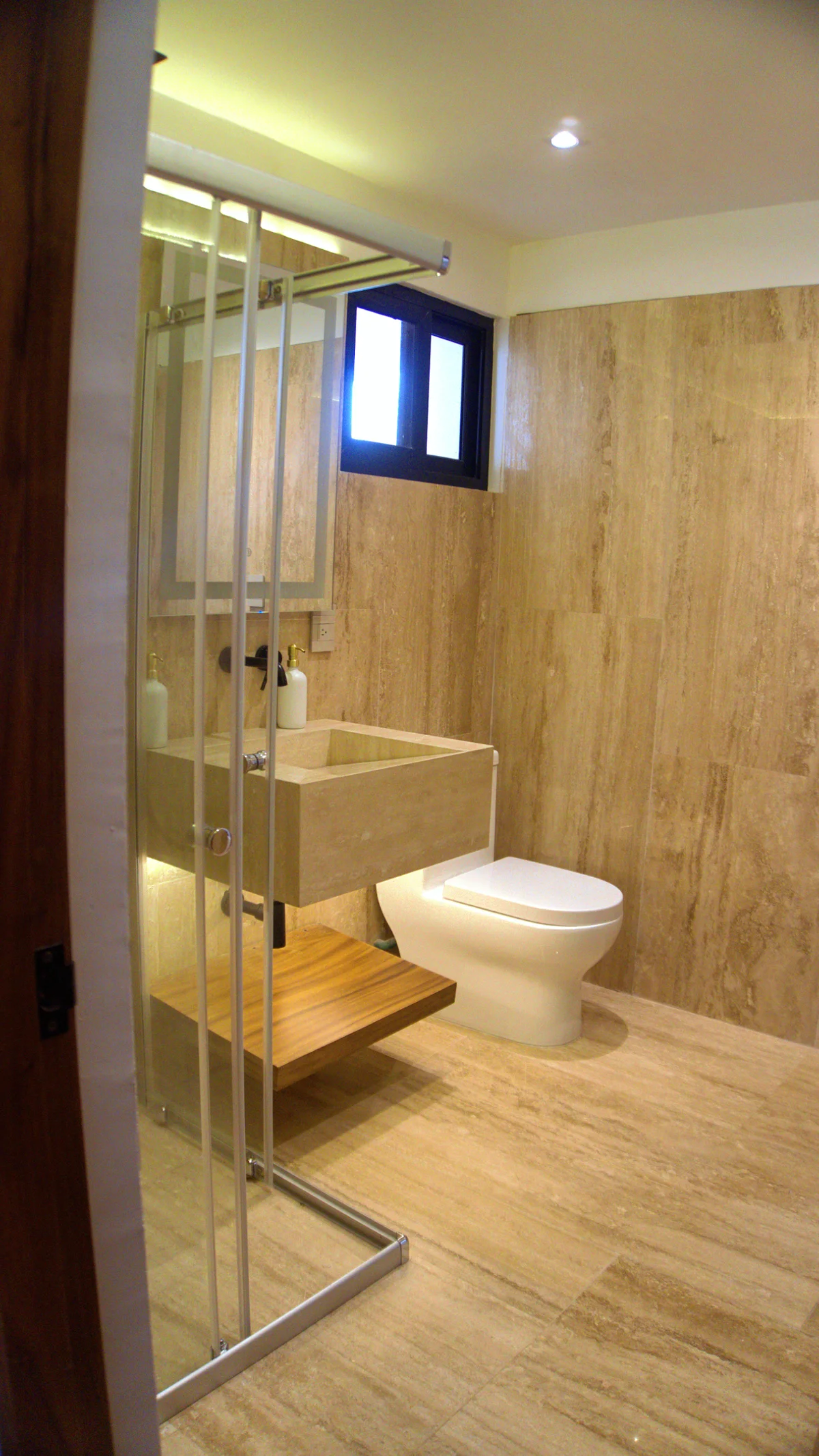 View of Modern Bathroom at Baikal, showcasing Floating Vanity, Stone Sink.