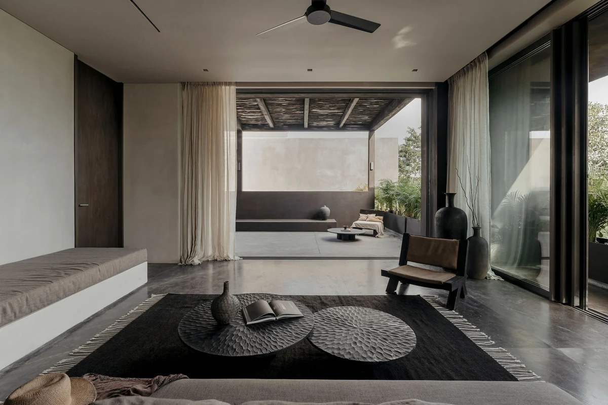 View of Modern Living Room at La Reserva, showcasing Indoor-Outdoor Living, Private Terrace.