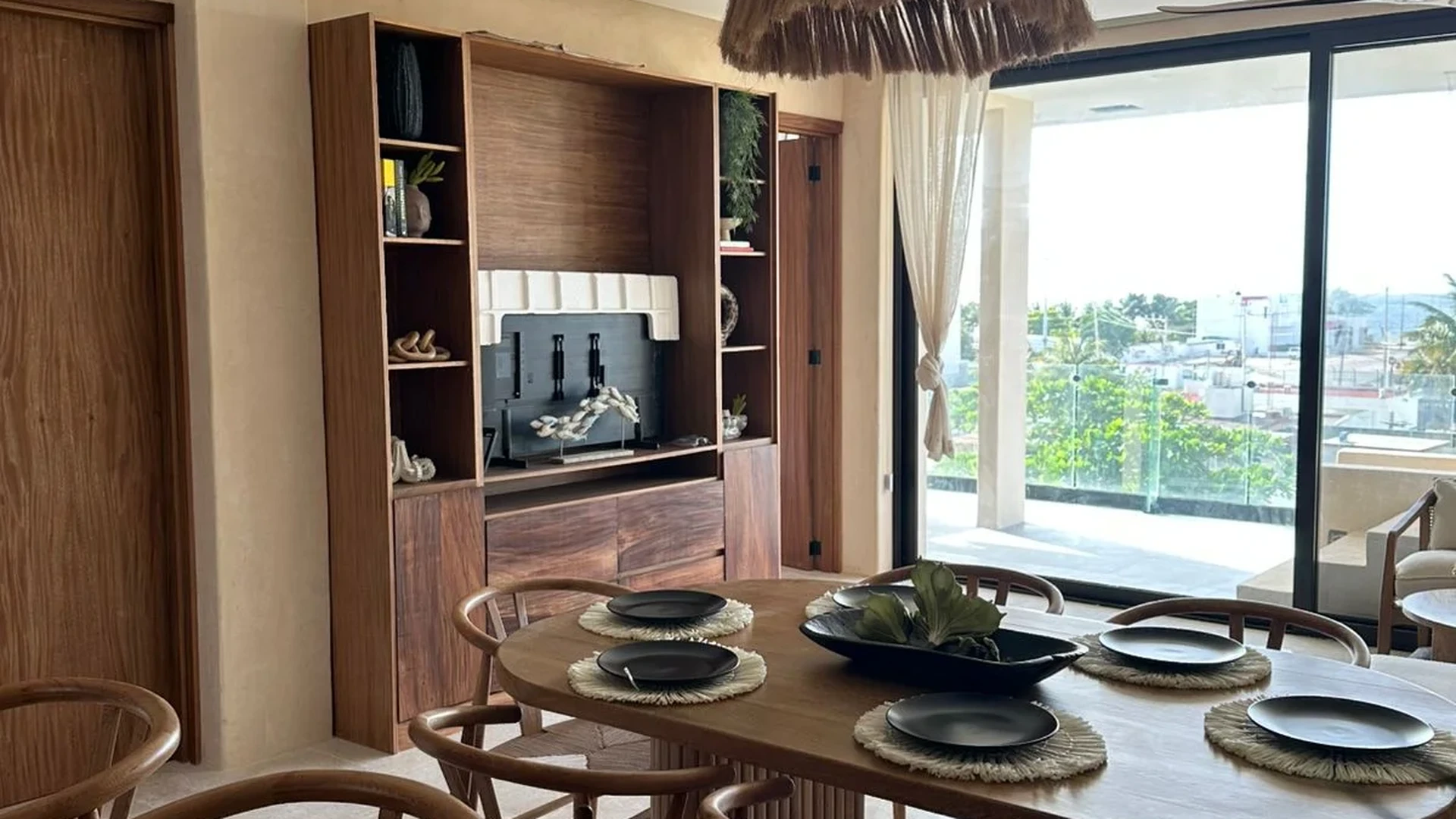 View of Dining Room at Alux 33, showcasing Modern Interior, Wood Furniture.