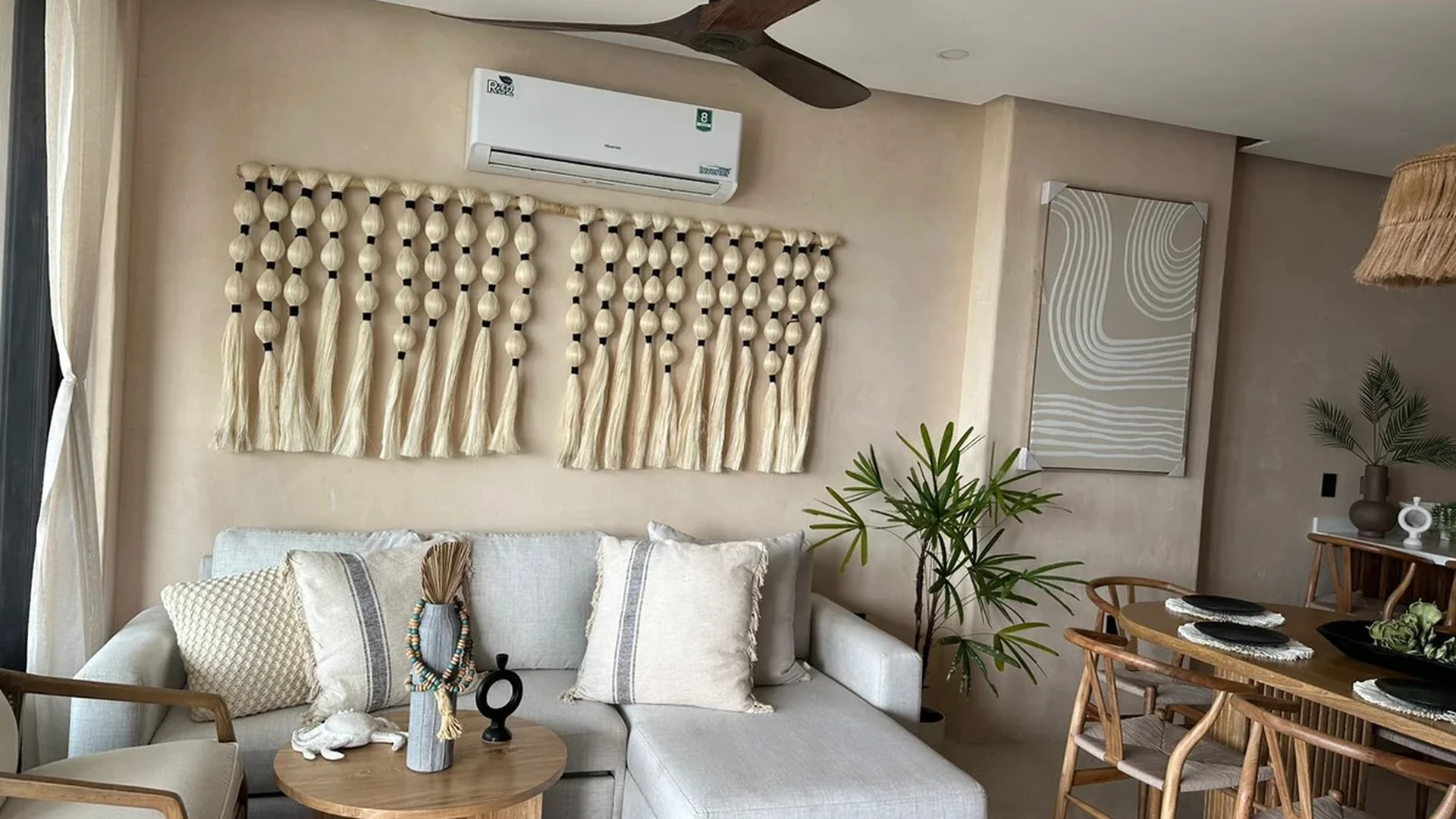 View of Living Room at Alux 33, showcasing Bohemian Decor, Neutral Tones.