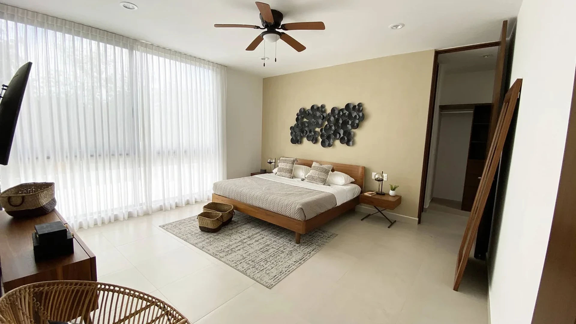 View of Modern Bedroom at Palmara, showcasing Natural Light, Floor-to-Ceiling Windows.