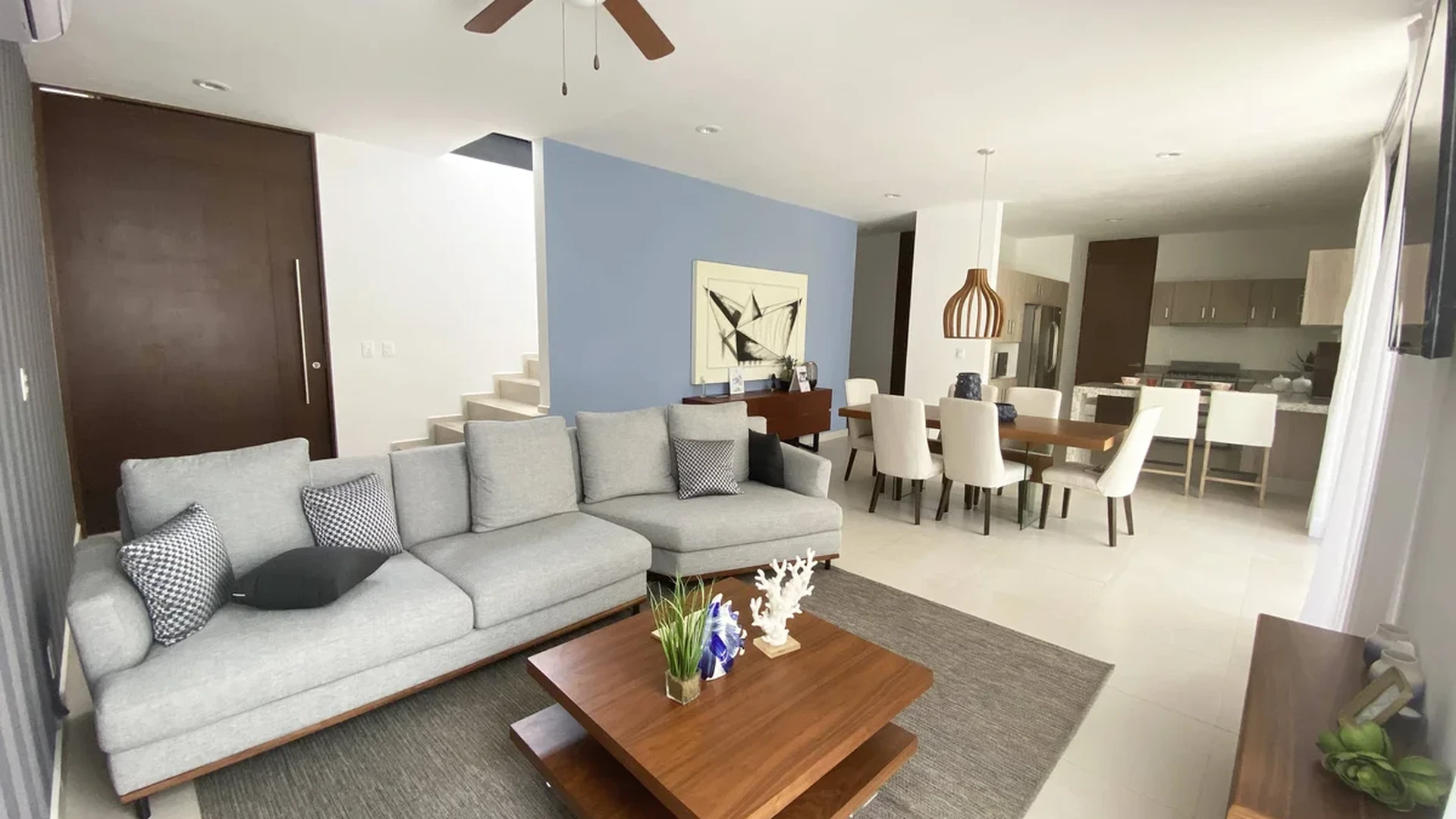 View of Open Concept Living at Palmara, showcasing Modern Living Room, Spacious Dining Area.