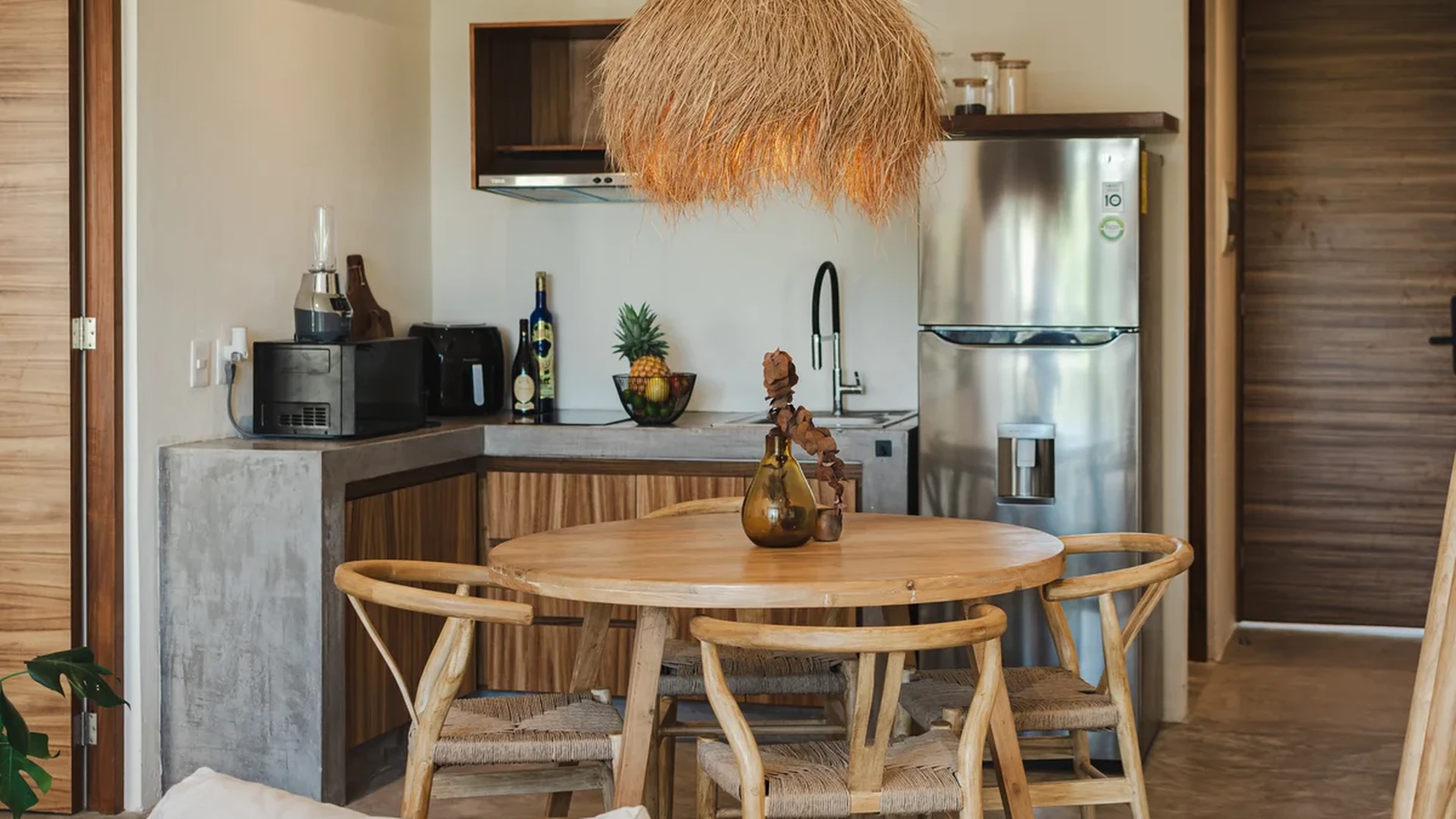 View of Modern Kitchenette at Gold Garden, showcasing Dining Area, Boho Chic Decor.