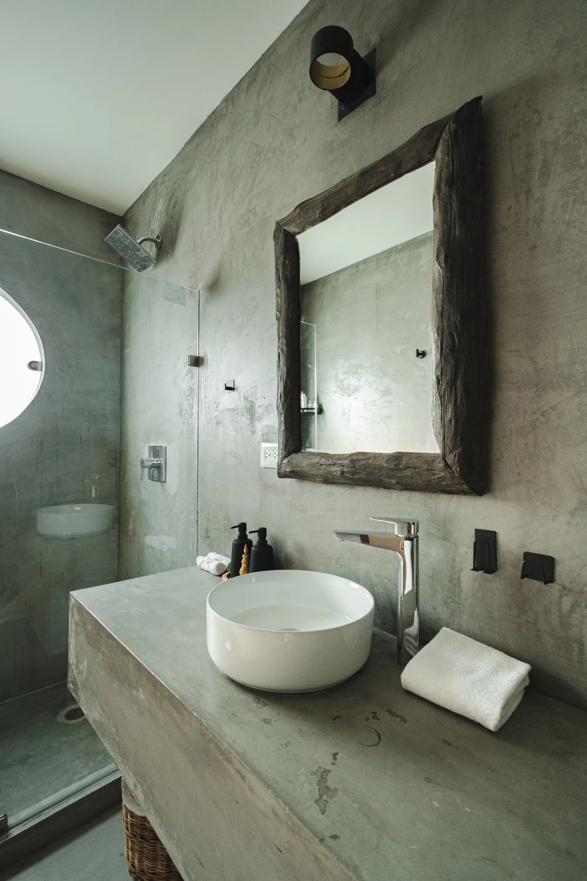View of Industrial Chic Bathroom at Gold Garden, showcasing Concrete Vanity, Vessel Sink.