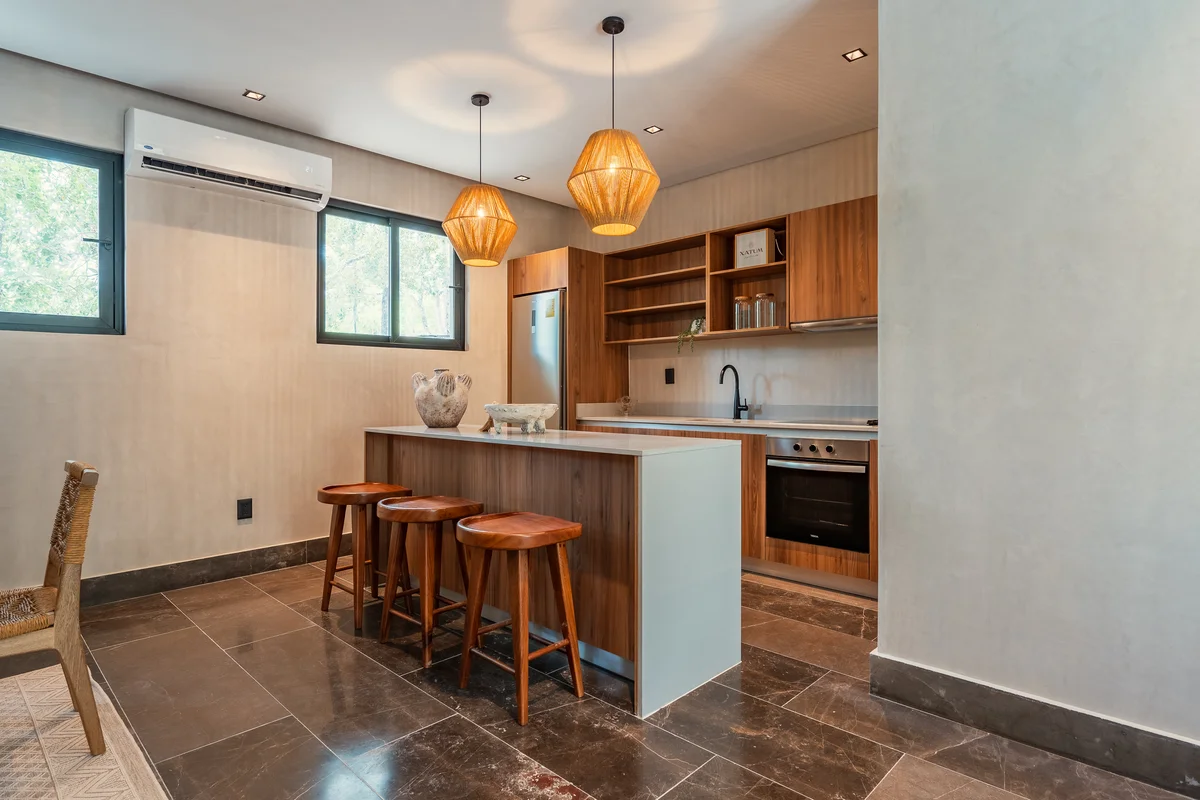 View of Modern Kitchen at Xatum, showcasing Kitchen Island, Wood Cabinetry.