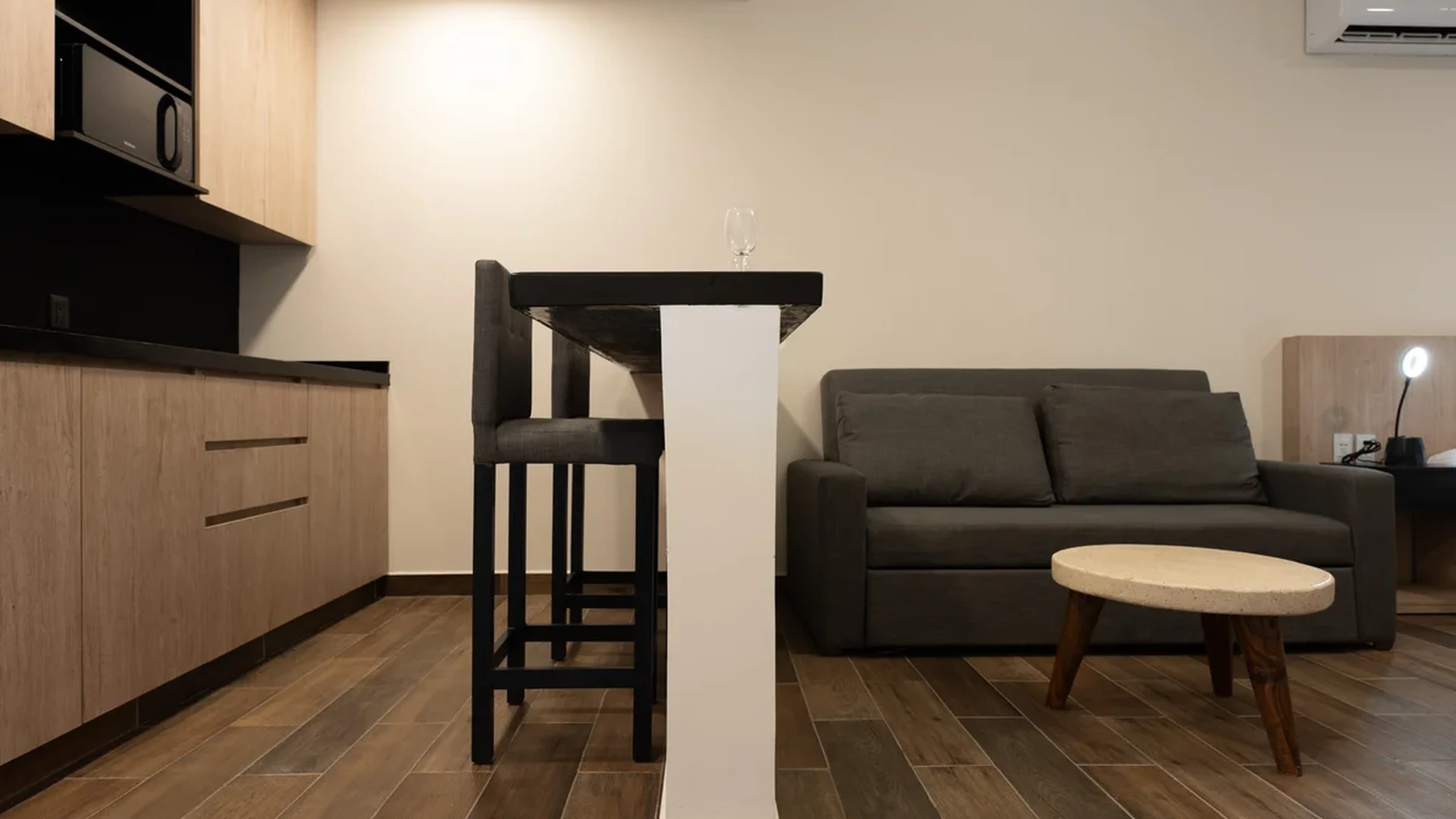 View of Studio Apartment at Wamai, showcasing Open Concept Living, Modern Kitchenette.