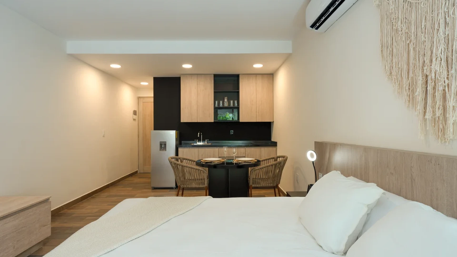 View of Studio Apartment at Wamai, showcasing Modern Kitchenette, Open Concept Living.