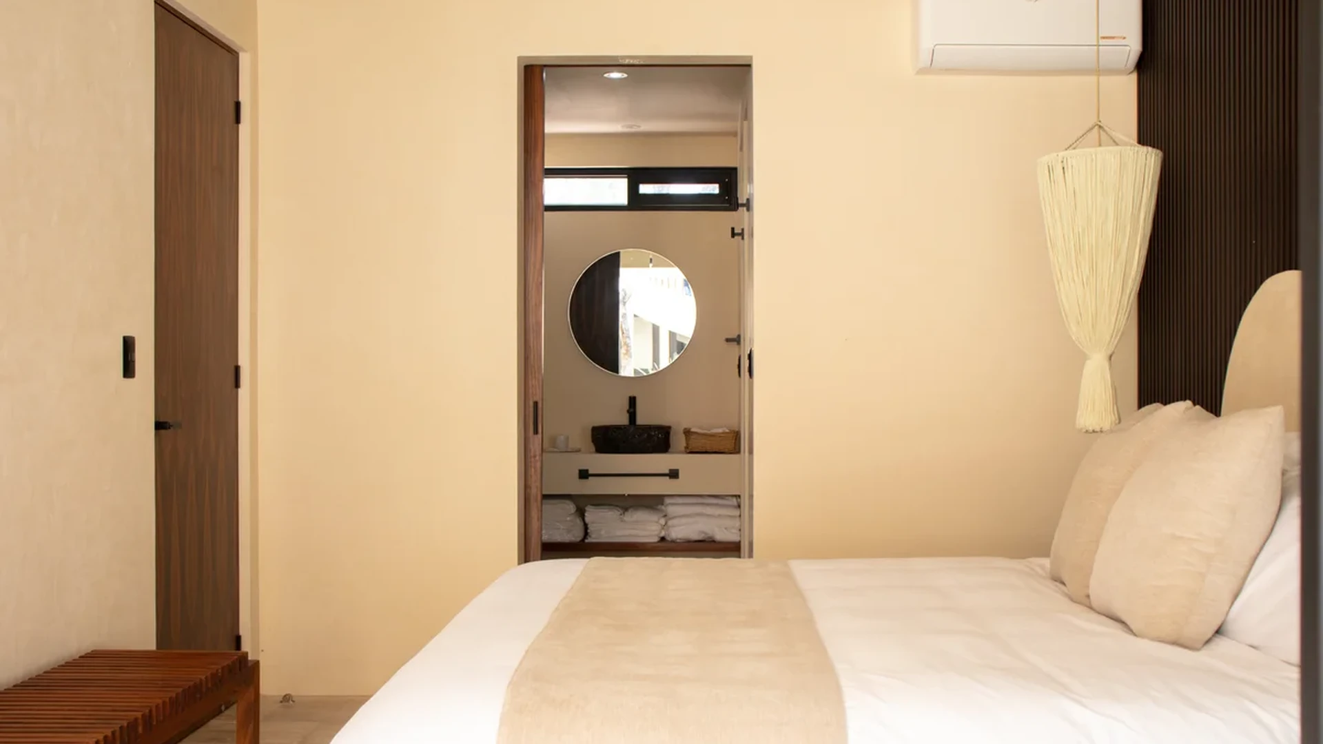 View of Bedroom at Loch, showcasing Ensuite Bathroom, Modern Design.