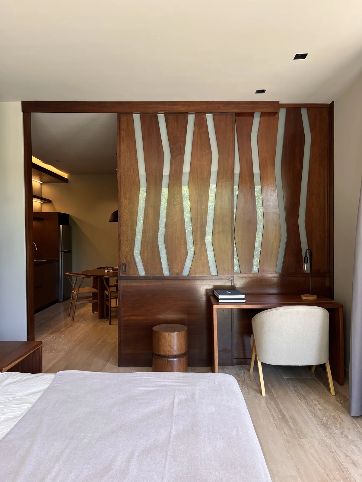View of Modern Bedroom at Arthouse, showcasing Studio Apartment, Wood Accent Wall.