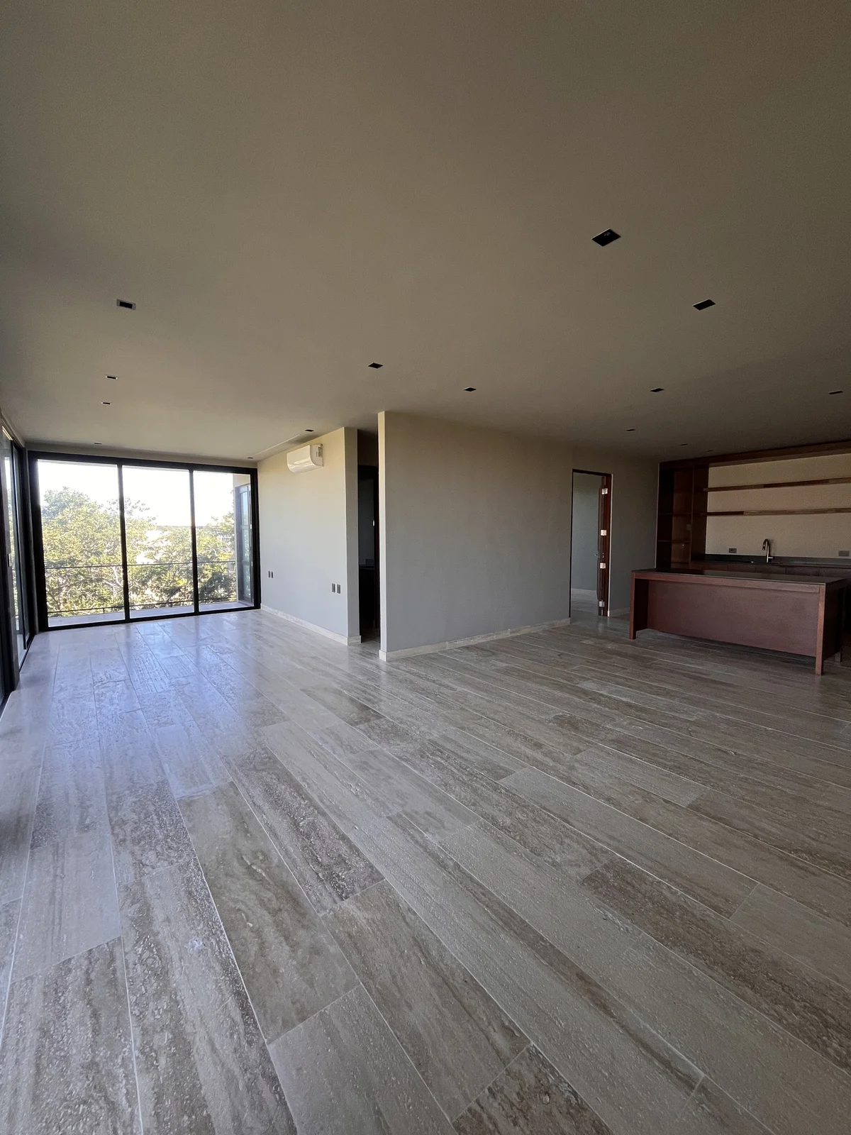 View of Open Concept Living at Arthouse, showcasing Spacious Interior, Stone Tile Flooring.