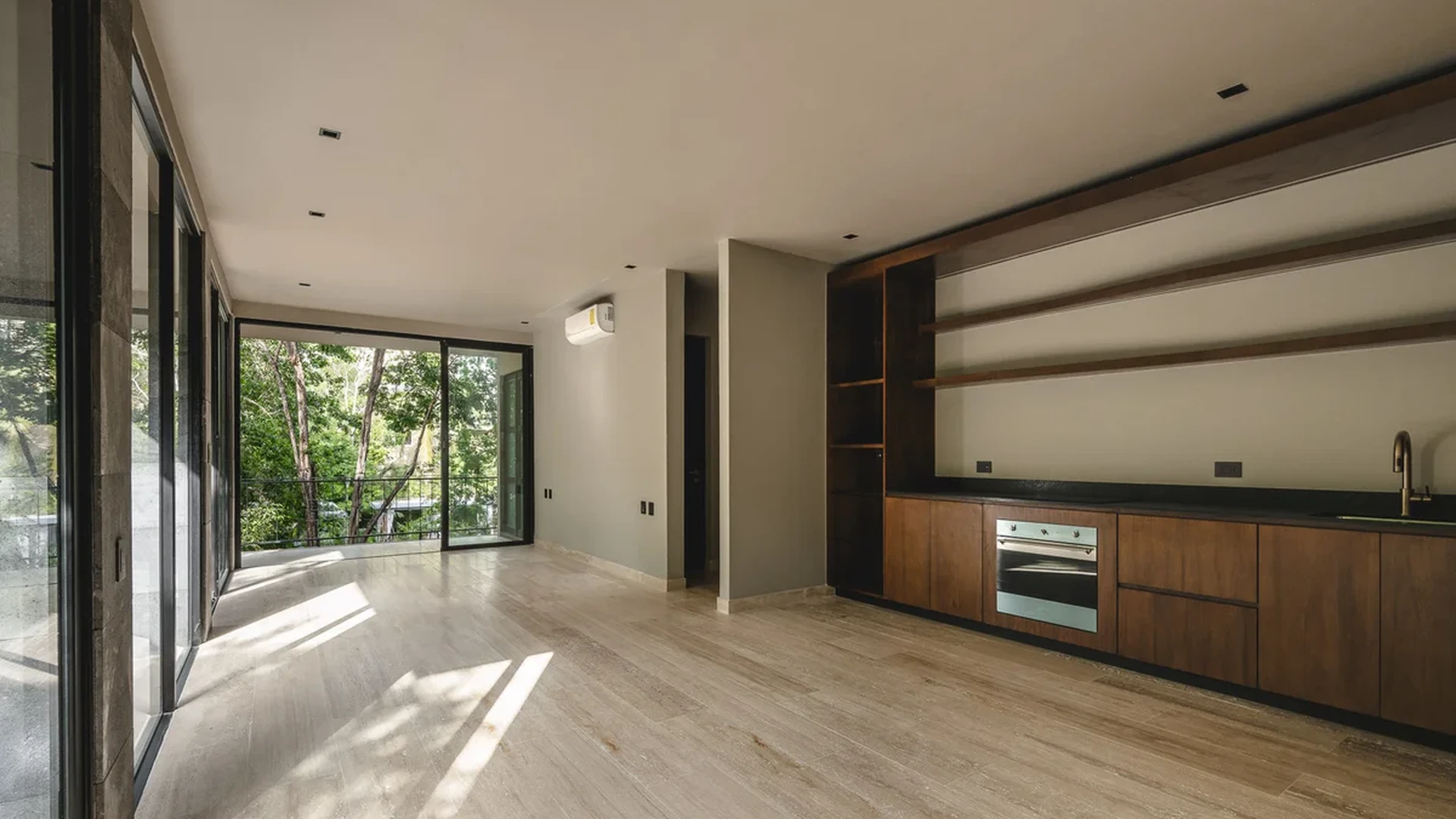View of Open Concept Living at Arthouse, showcasing Modern Kitchenette, Wood Cabinetry.