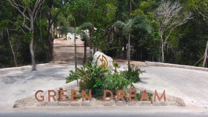 Image of Garden at Green Dream, featuring Gated Community Entrance, Lush Landscaping.
