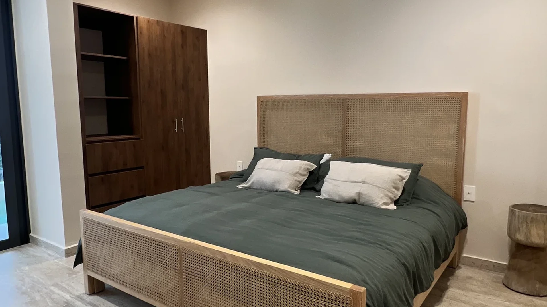 View of Bedroom at Constelada, showcasing Rattan Furniture, Cane Bed Frame.
