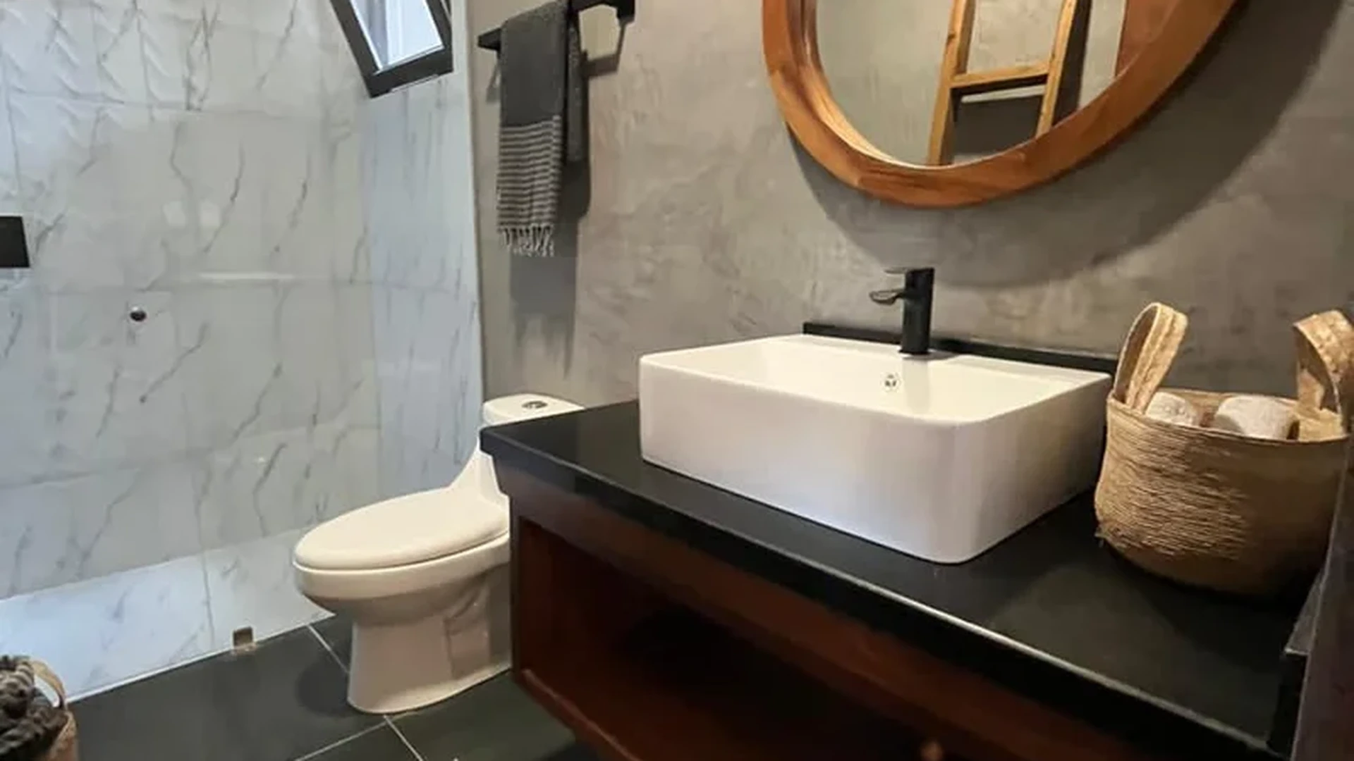 View of Modern Bathroom at Hoja Santa, showcasing Rustic Design, Concrete Finish Walls.