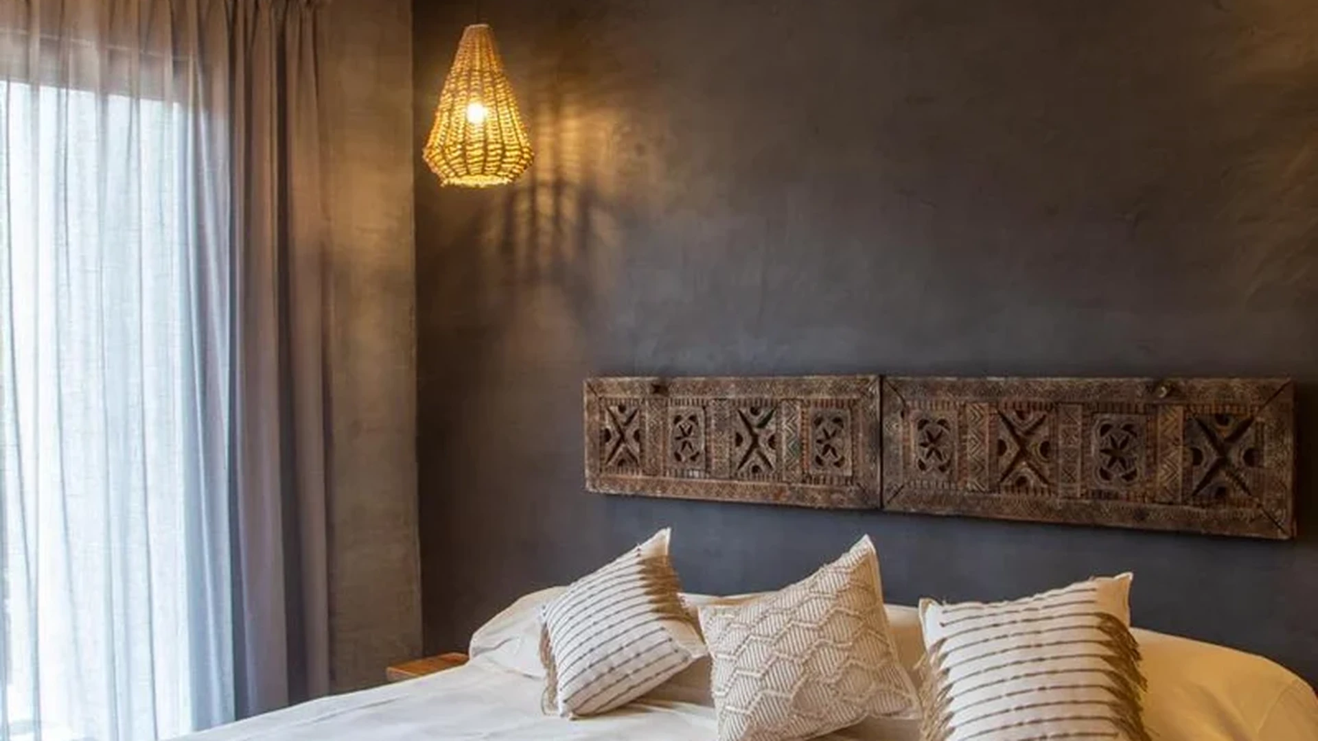 View of Bedroom at Hoja Santa, showcasing Bohemian Decor, Rustic Design.