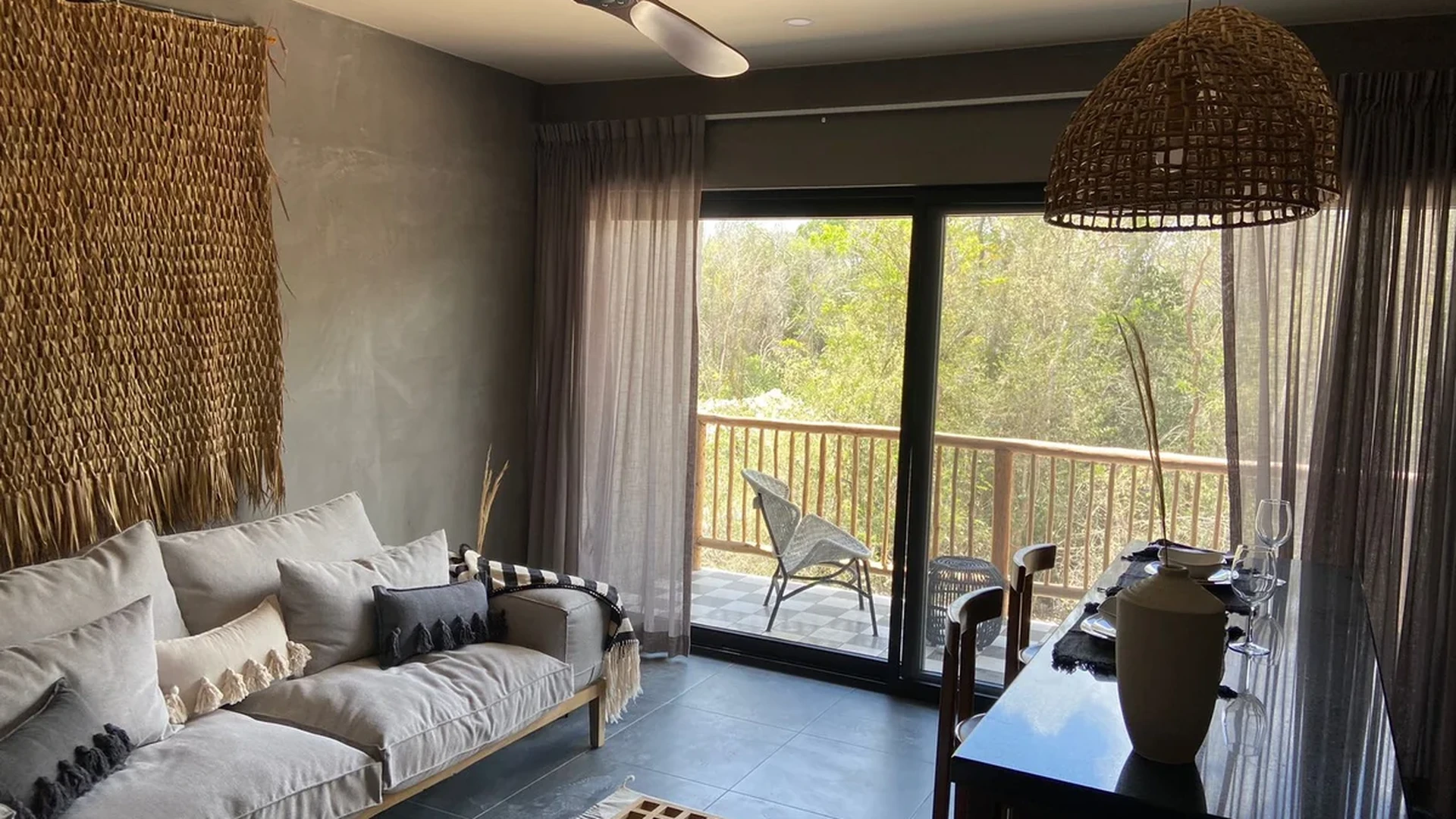 View of Open Concept Living at Hoja Santa, showcasing Natural Light, Private Balcony.