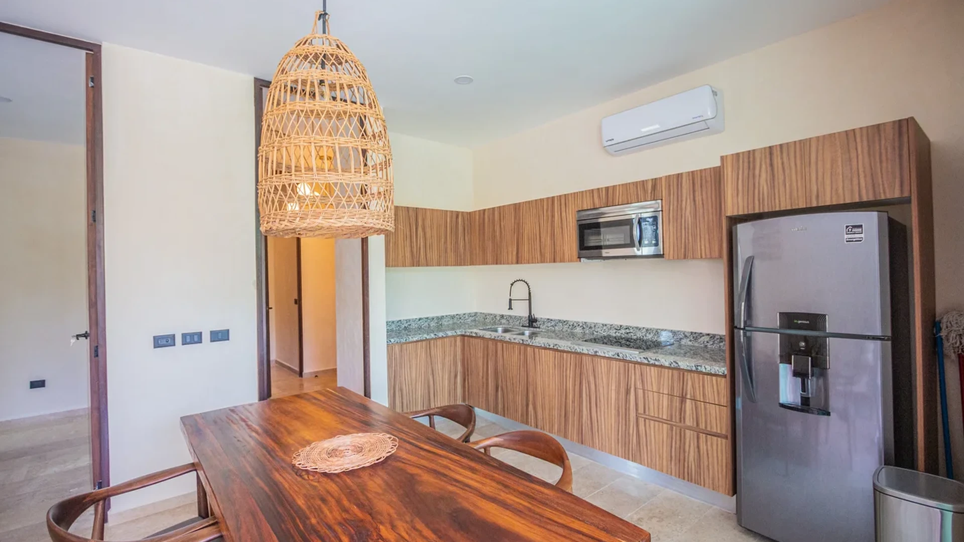 View of Modern Kitchen at Habaneros, showcasing Wood Cabinetry, Granite Countertops.