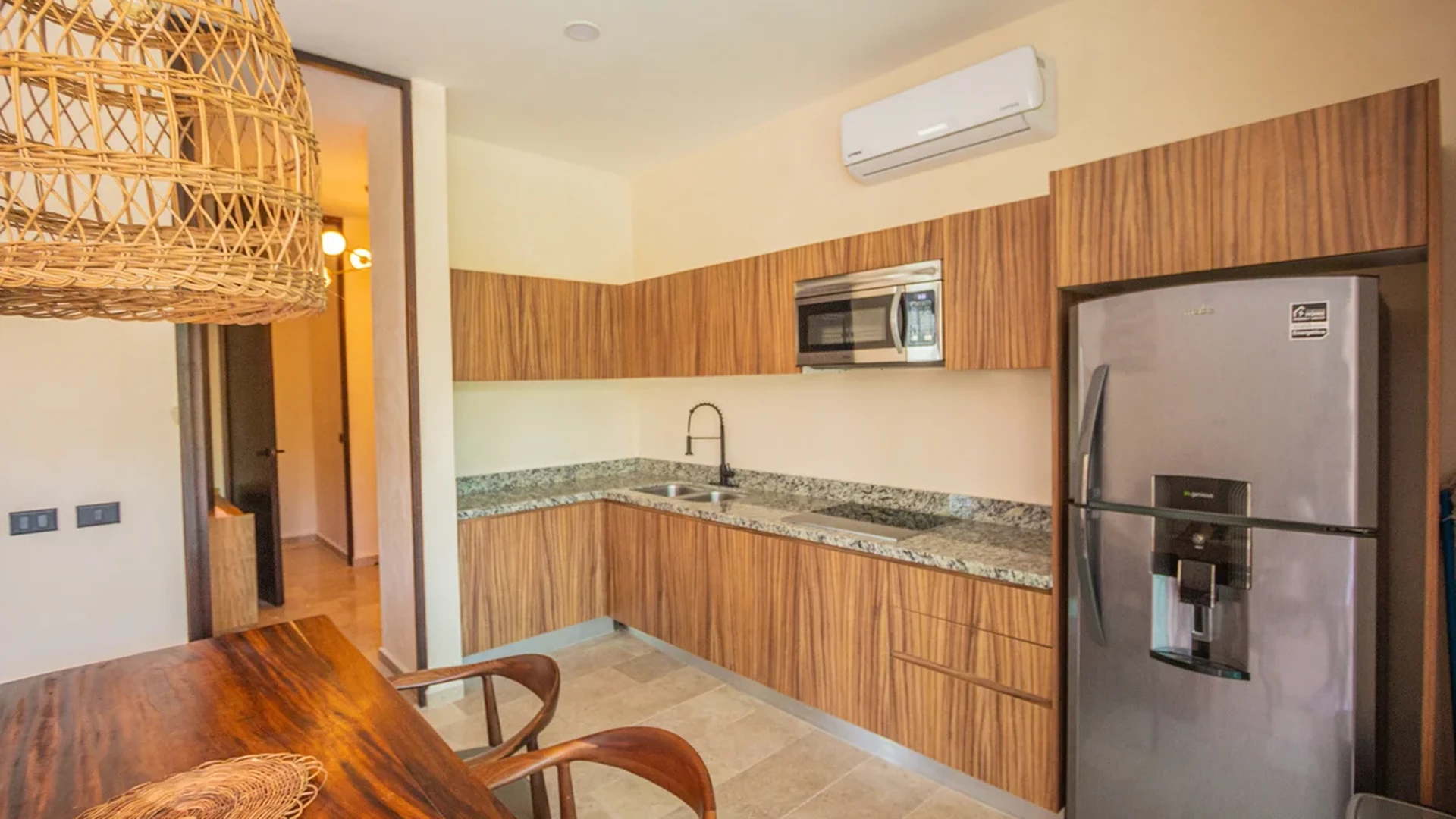 View of Modern Kitchen at Habaneros, showcasing Dining Area, Wood Cabinetry.