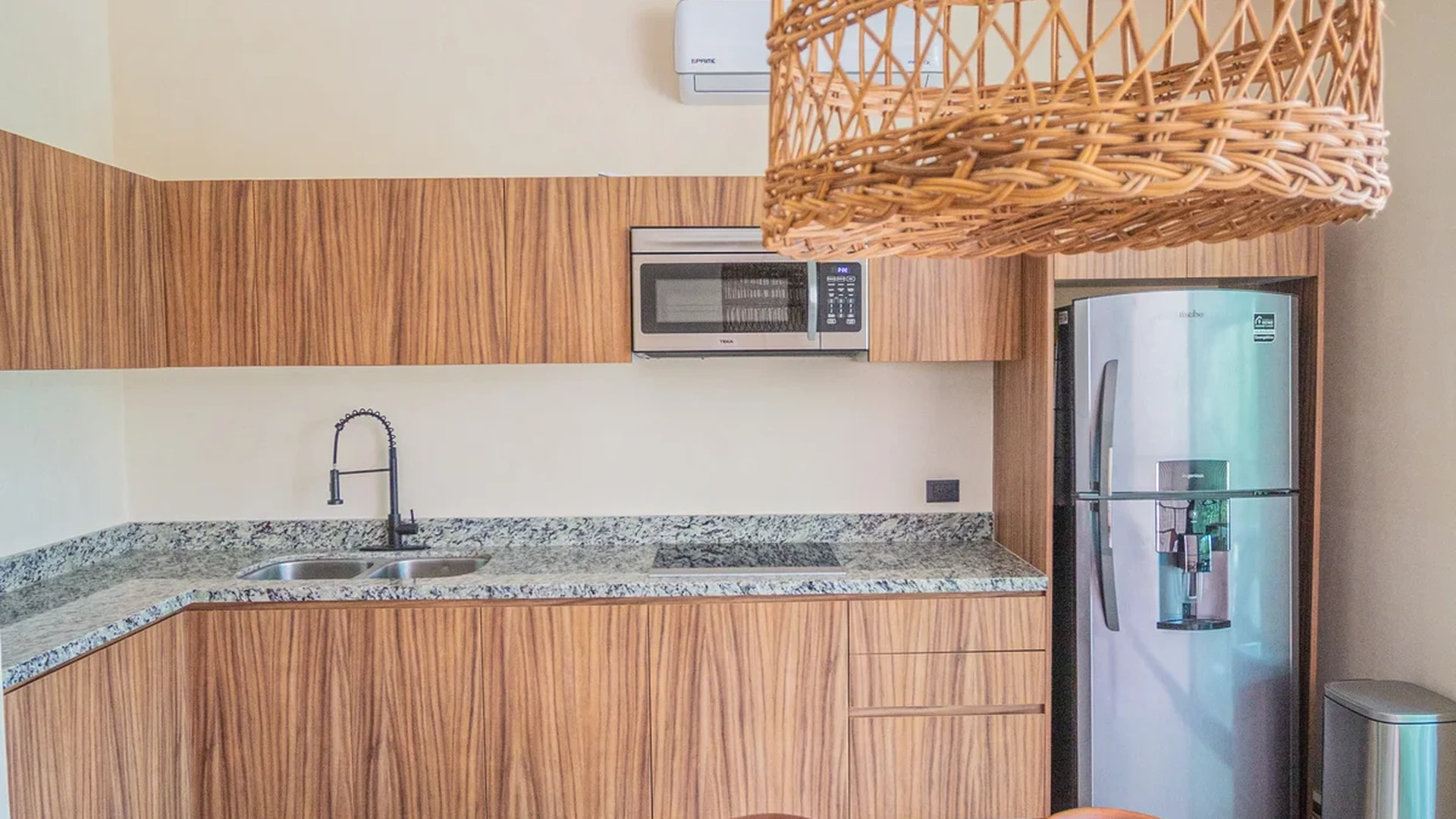 View of Modern Kitchen at Habaneros, showcasing Dining Area, Wood Cabinetry.