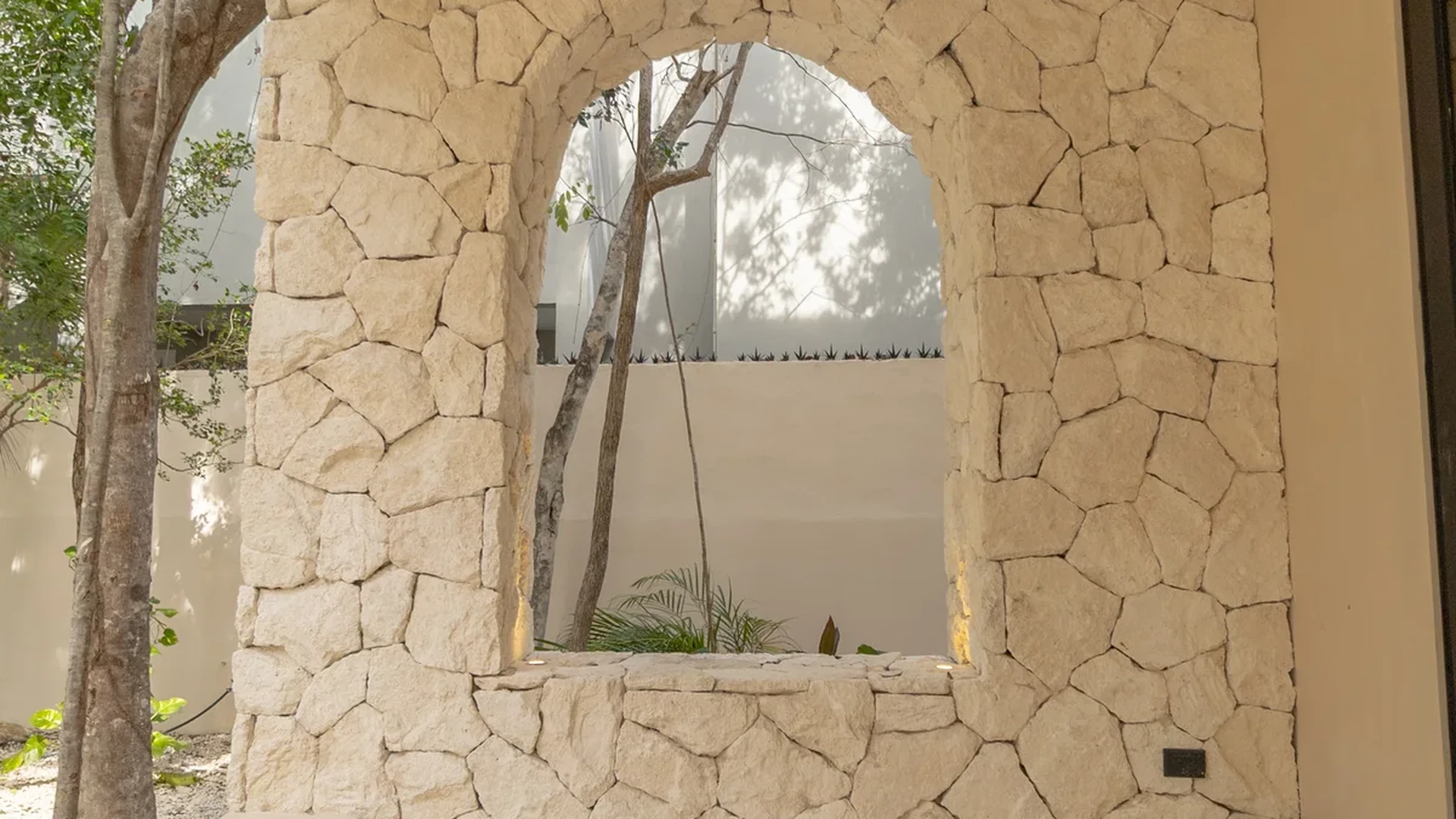 Image of Garden at Villas INMOVA, featuring Covered Patio, Stone Wall Feature.