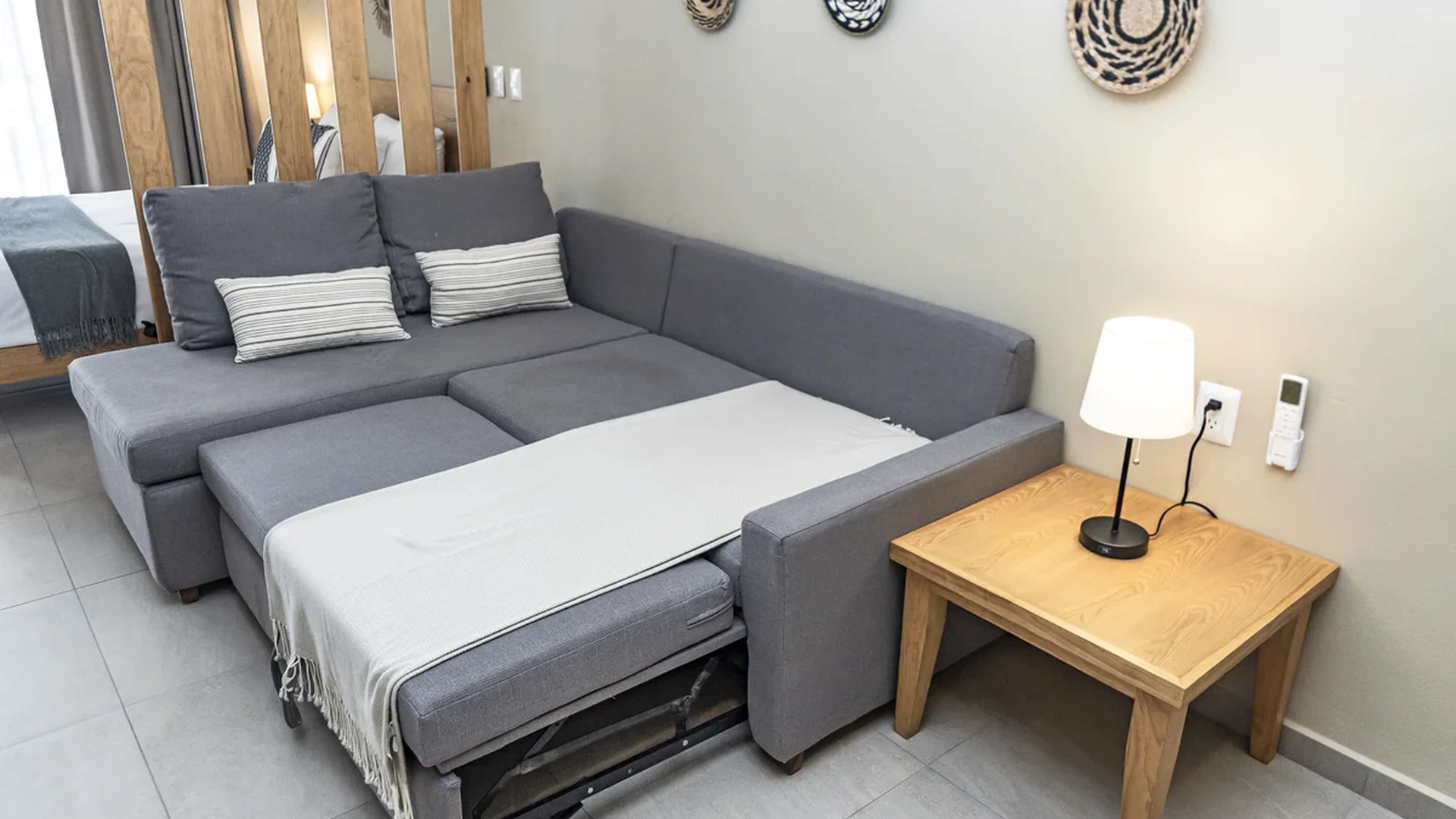 View of Living Area at Levitat 20, showcasing Sleeper Sofa, Modern Decor.