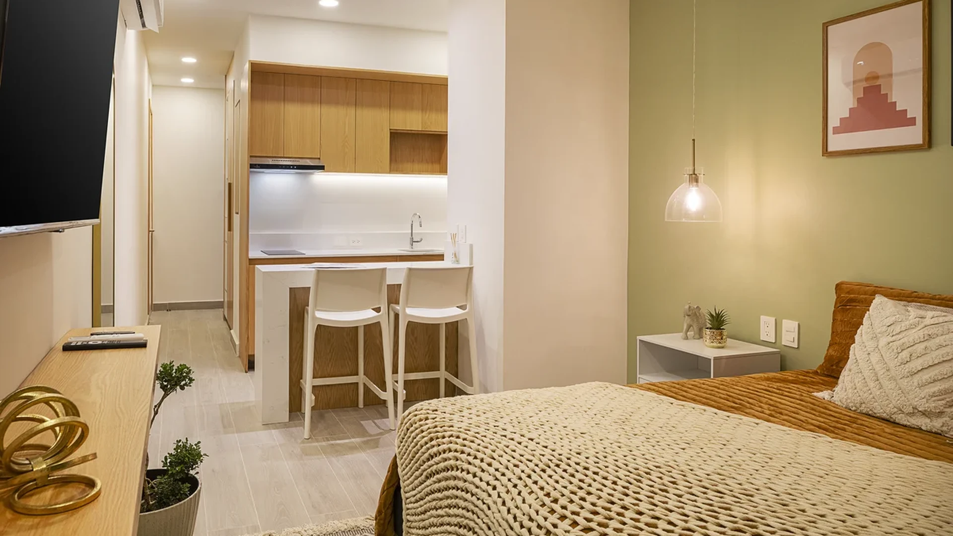 View of Studio Apartment at Le 35 Residences, showcasing Modern Kitchenette, Open Concept Living.