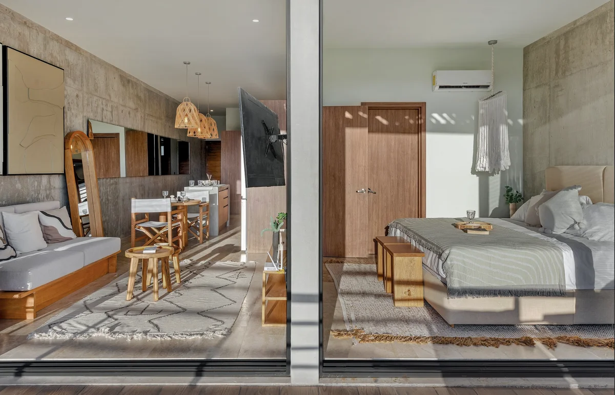 View of Modern Apartment at BeUTiful, showcasing Studio Living, Concrete Walls.