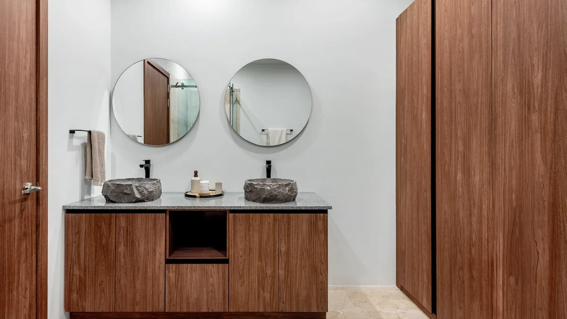 View of Modern Bathroom at BeUTiful, showcasing Dual Vanity, Stone Vessel Sinks.