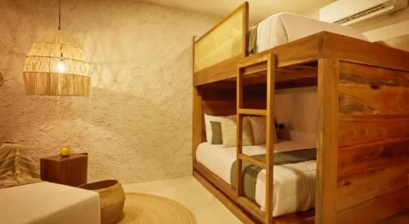 View of Bedroom at Tamarindos, showcasing Bunk Beds, Wooden Furniture.