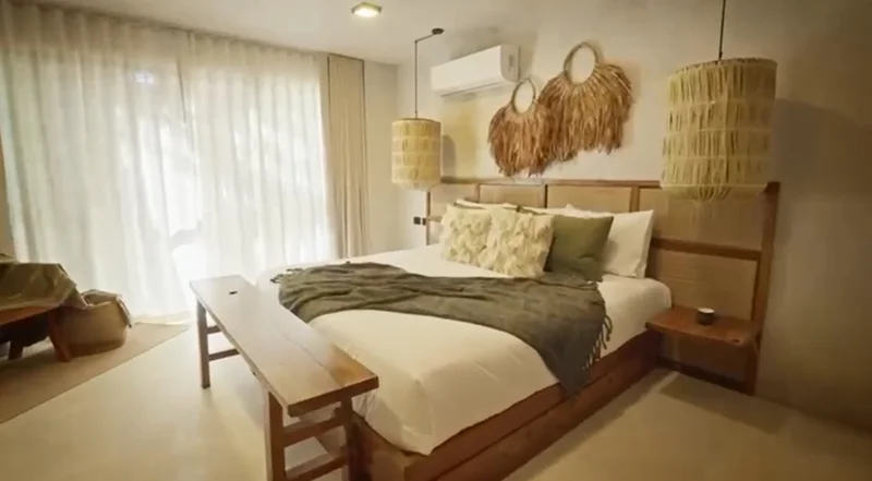 View of Bedroom at Tamarindos, showcasing Bohemian Decor, Natural Lighting.