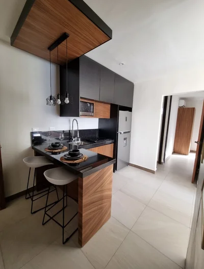 View of Modern Kitchen at Mya Black Diamond, showcasing Kitchen Island, Breakfast Bar.
