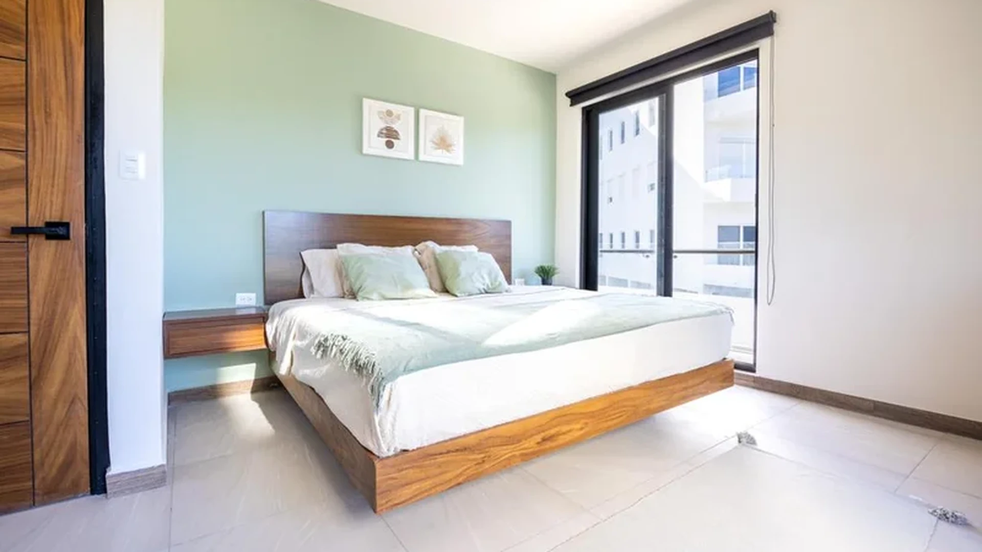 View of Modern Bedroom at Mya Black Diamond, showcasing Natural Light, Floating Bed.