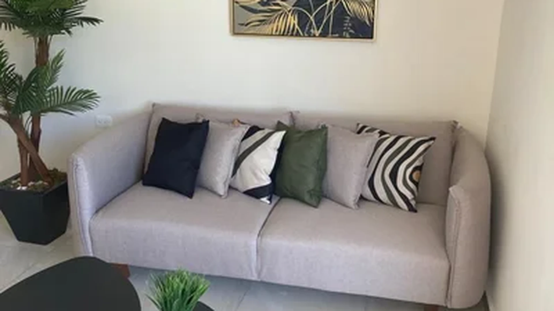 View of Living Room at Mya Black Diamond, showcasing Modern Decor, Staged Interior.