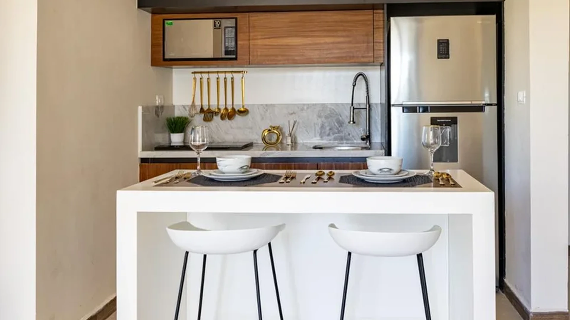 View of Modern Kitchenette at Mya Black Diamond, showcasing Breakfast Bar, Compact Kitchen.