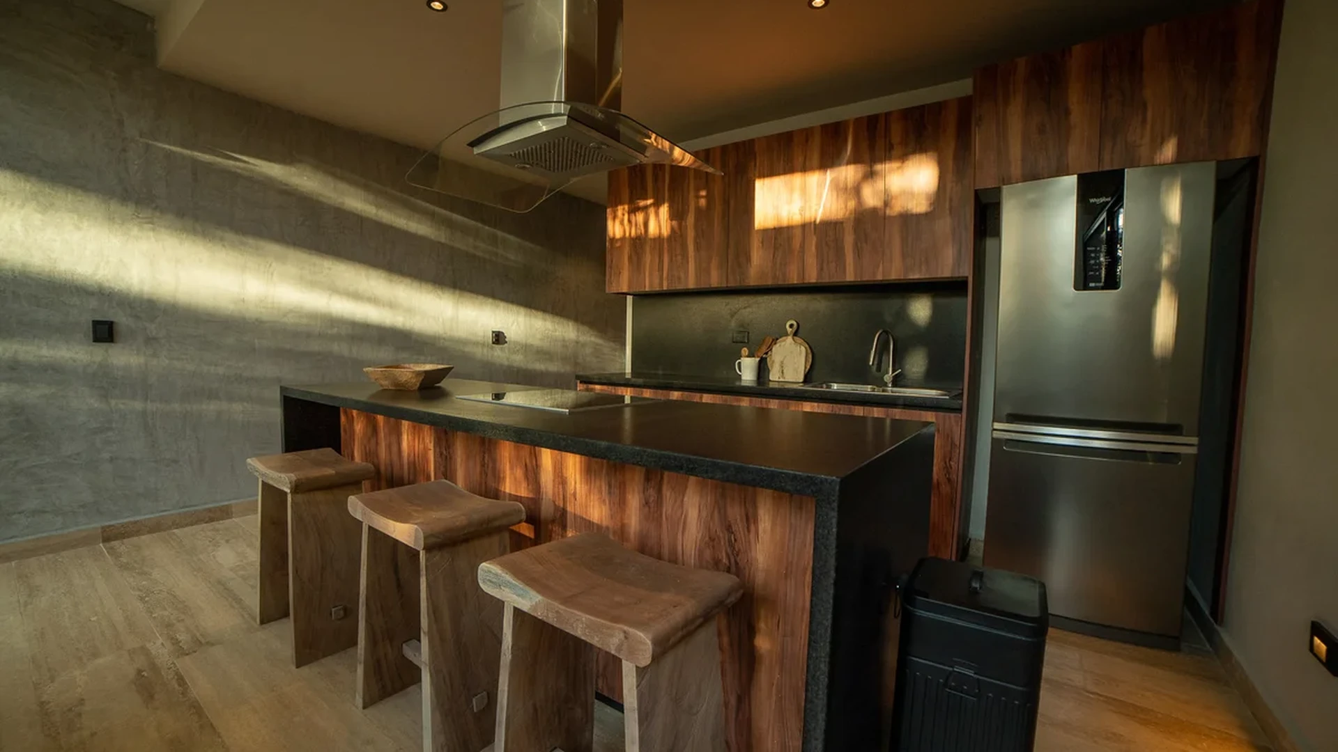 View of Modern Kitchen at Attha Holistika, showcasing Kitchen Island, Wood Cabinetry.
