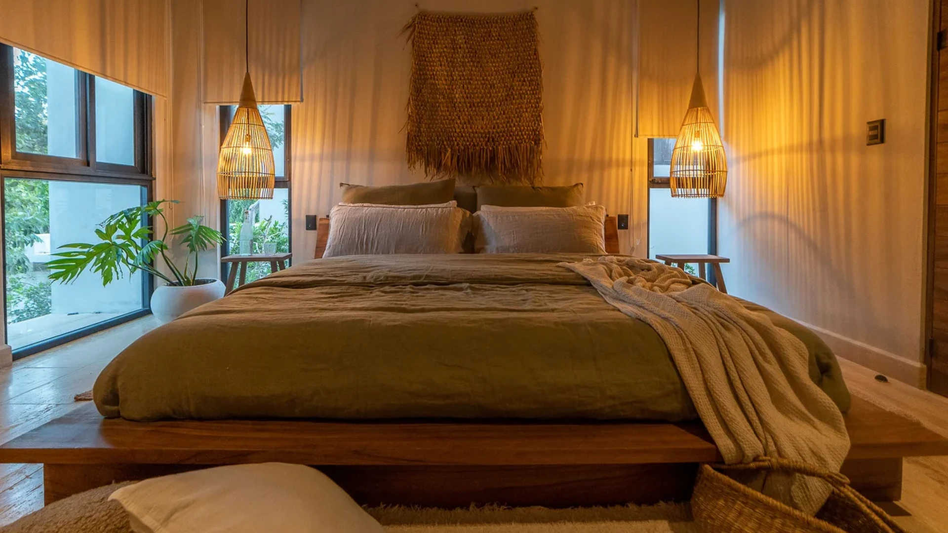 View of Bedroom at Attha Holistika, showcasing Boho Chic Decor, Wood Platform Bed.