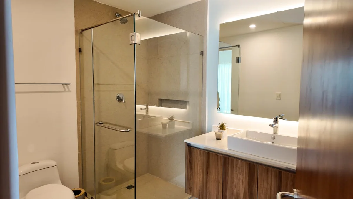 View of Modern Bathroom at The Leaf, showcasing Glass Shower, Rainfall Showerhead.