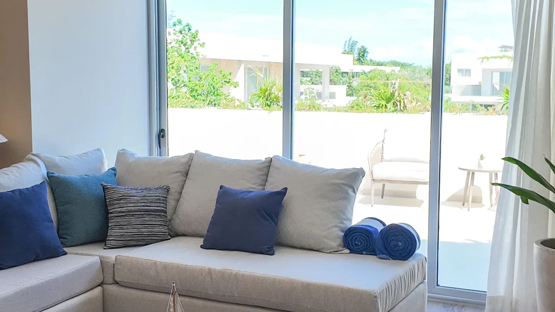 View of Living Room at The Leaf, showcasing Natural Light, Sectional Sofa.