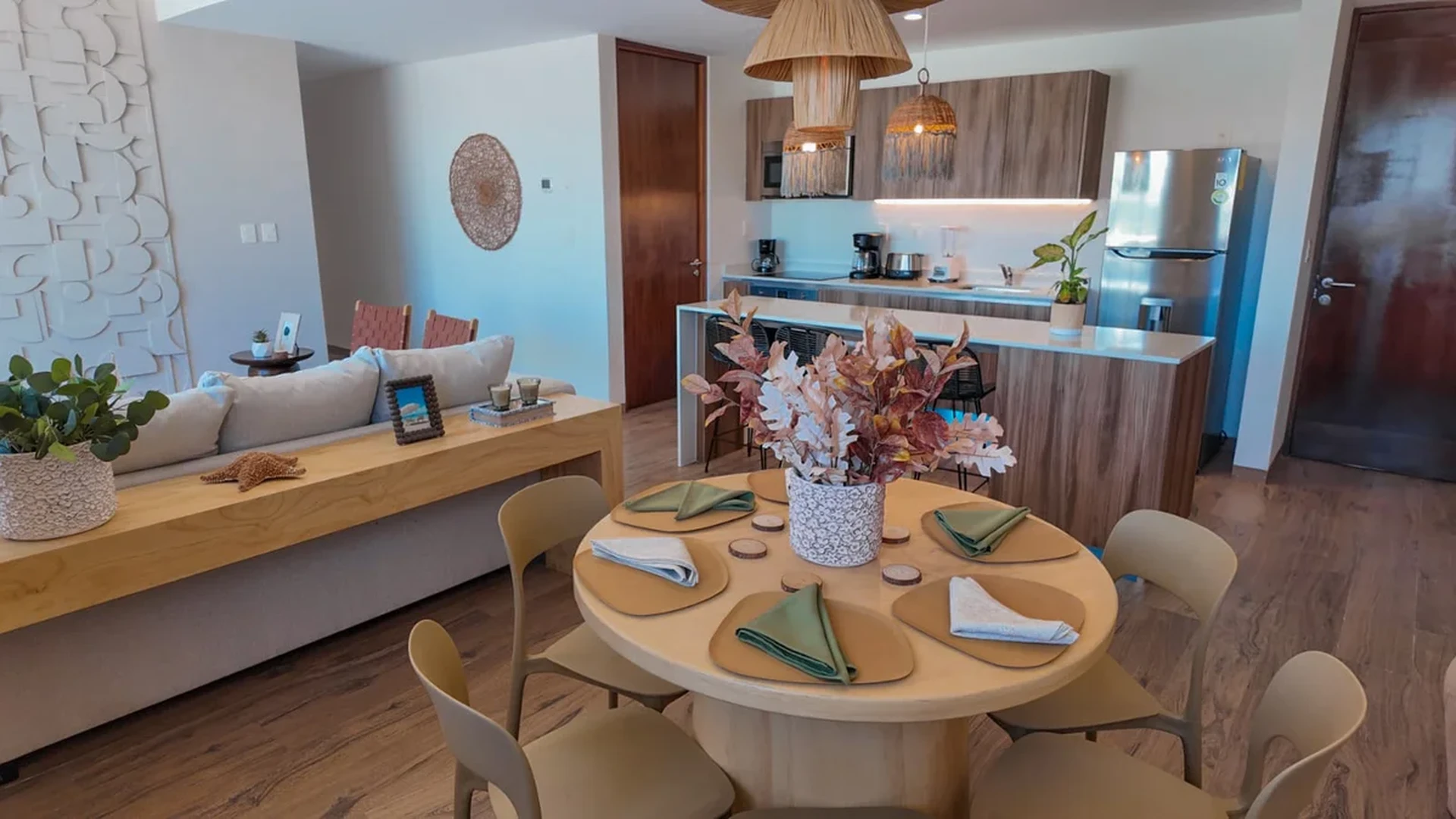 View of Open Concept Living at The Leaf, showcasing Modern Kitchen, Dining Area.