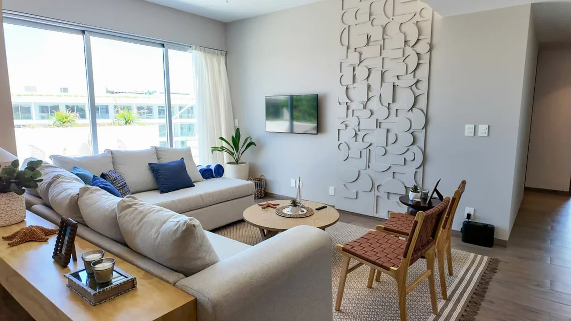 View of Modern Living Room at The Leaf, showcasing Natural Light, Open Floor Plan.