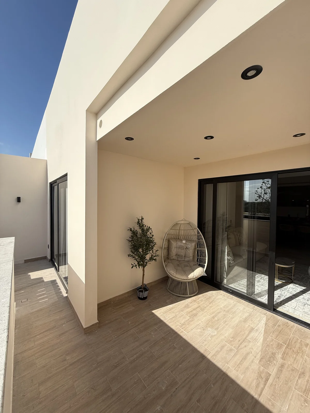 View of Covered Patio at iX, showcasing Private Balcony, Outdoor Living Space.