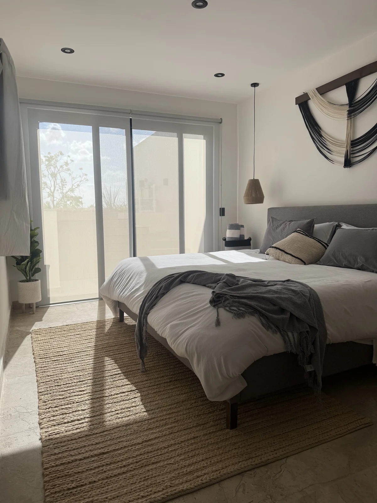 View of Modern Bedroom at iX, showcasing Natural Light, Boho Decor.