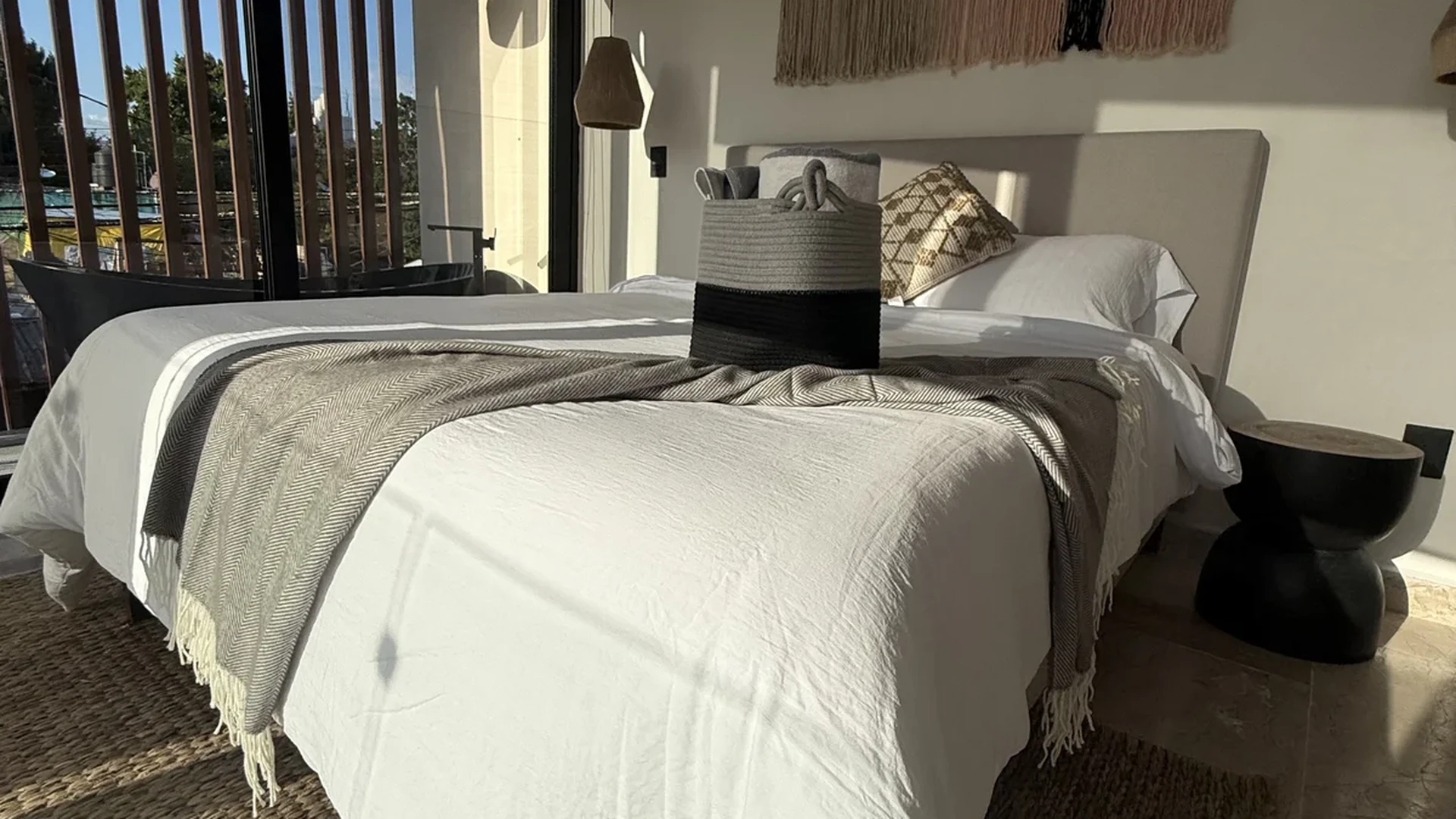 View of Modern Bedroom at iX, showcasing Natural Light, Boho Chic Decor.