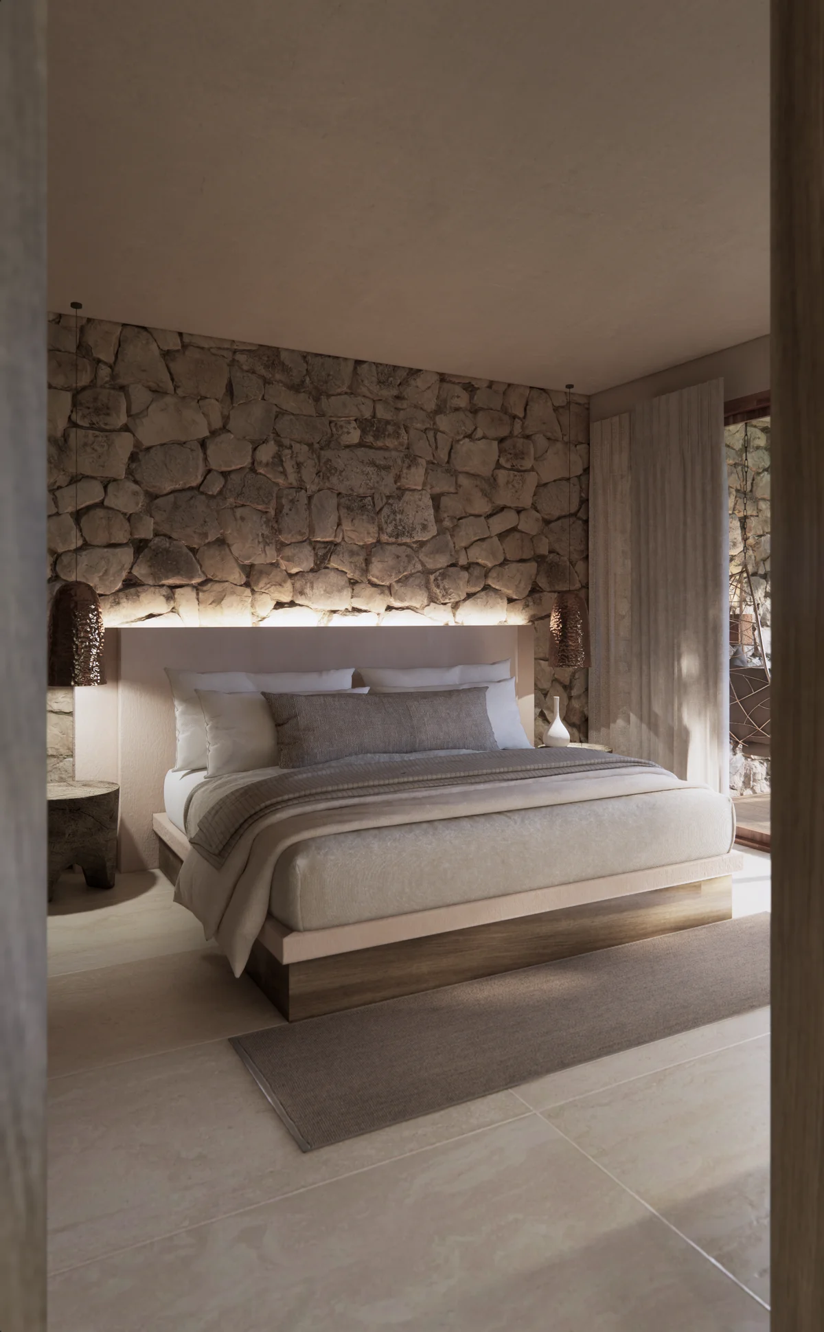 View of Luxury Bedroom at Ekab Tulum, showcasing Stone Accent Wall, Modern Rustic Design.