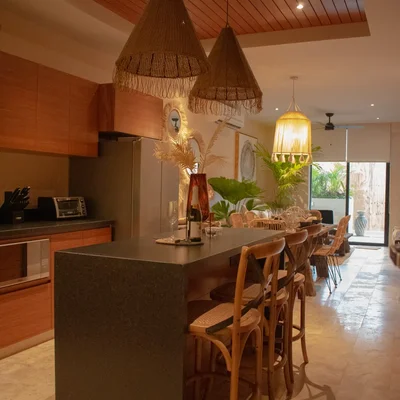 View of Open Concept Living at Deja Vu, showcasing Kitchen Island, Dining Area.