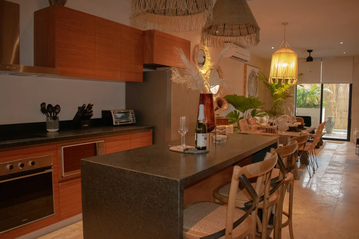 View of Open Concept Living at Deja Vu, showcasing Kitchen Island, Dining Area.