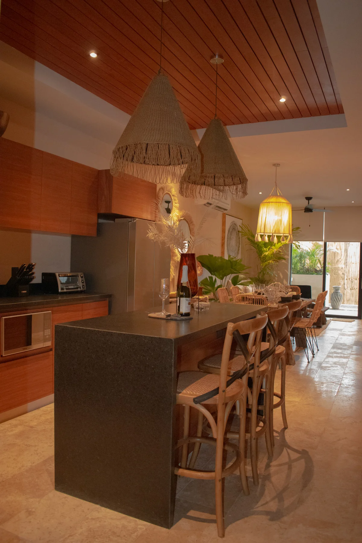 View of Open Concept Living at Deja Vu, showcasing Kitchen Island, Boho Chic Decor.